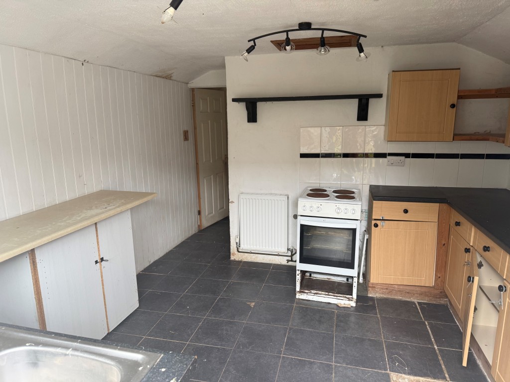 Lot: 38 - TWO-BEDROOM TERRACED COTTAGE FOR UPDATING WITH PARKING - Kitchen looking towards front of property